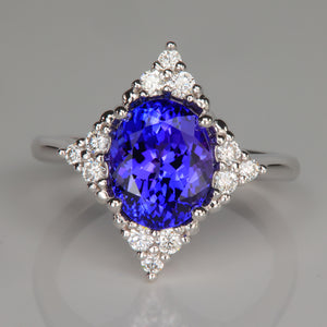 blue violet oval cut tanzanite and diamond white gold ring
