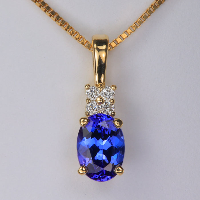 yellow gold oval tanzanite and diamond pendant