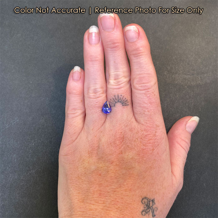 size of pear tanzanite gem on hand