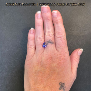 size of pear tanzanite gem on hand