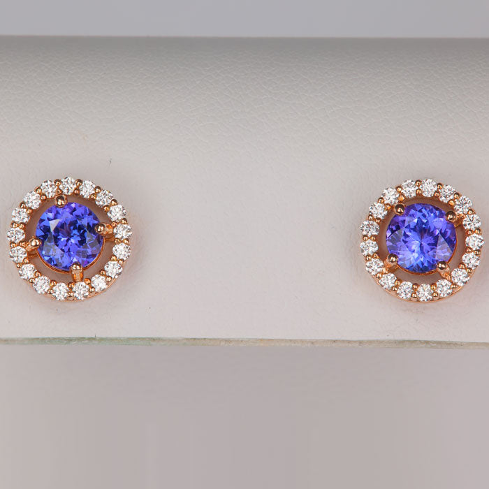 round tanzanite gemstone earrings in rose gold with diamond halo