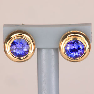 round brilliant tanzanite earrings bezel set yellow gold