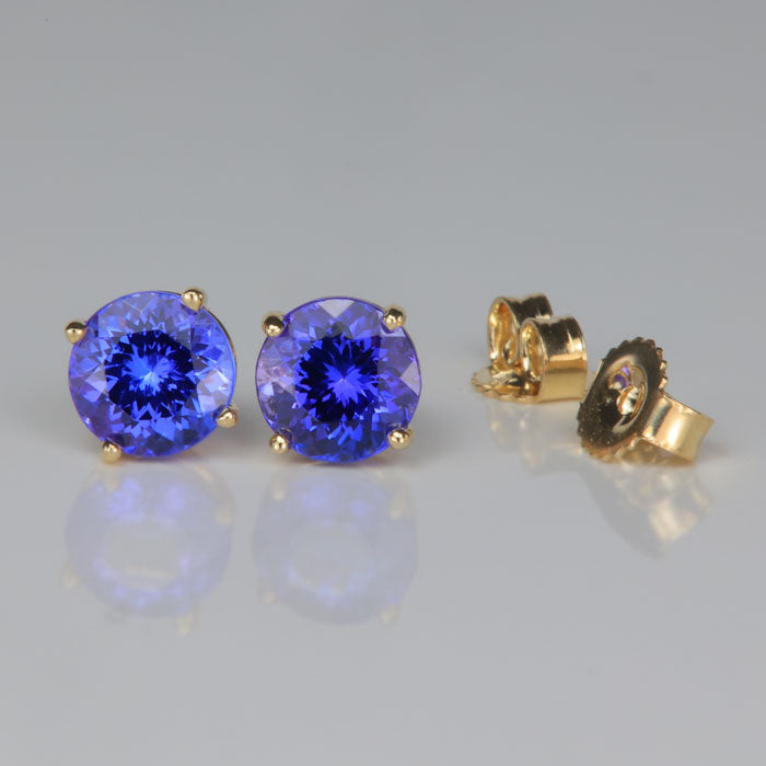 round brilliant tanzanite gemstone stud earrings in yellow gold