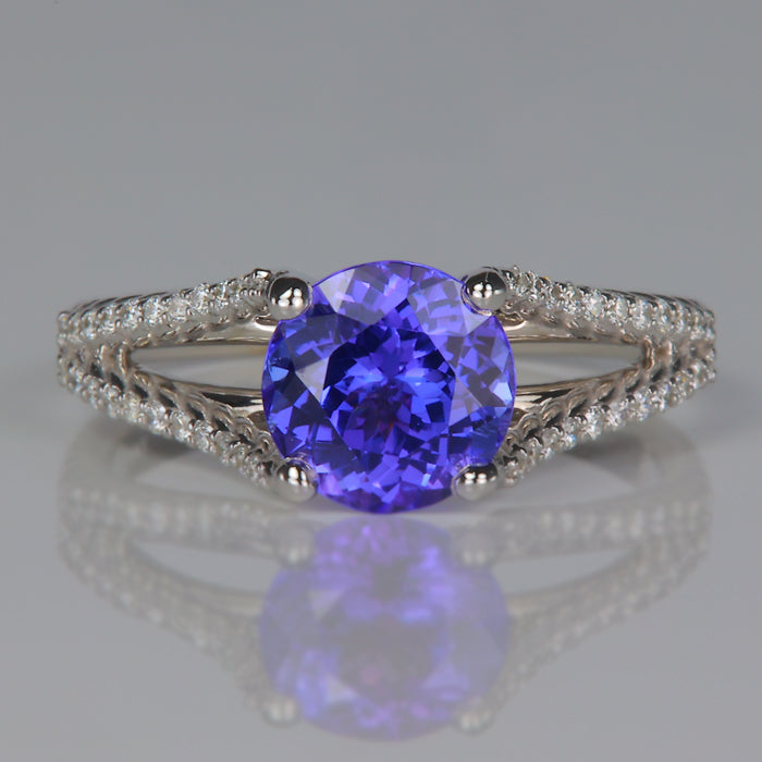 round brilliant tanzanite gemstone ring in white gold with diamonds