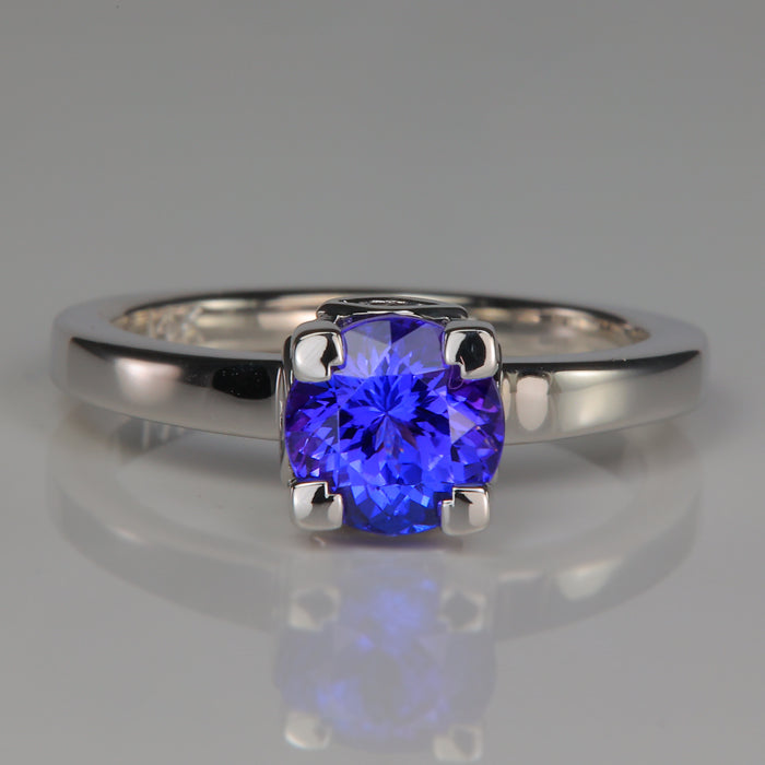 white gold tanzanite and peekaboo diamond accents ring