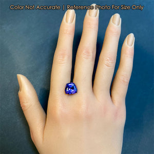 shield cut blue violet tanzanite on hand size