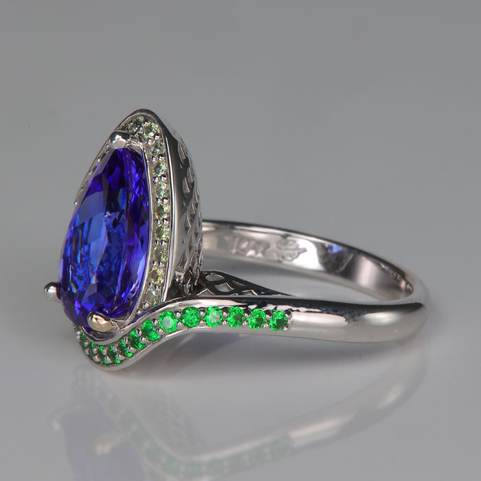 garnet accented tanzanite gemstone ring