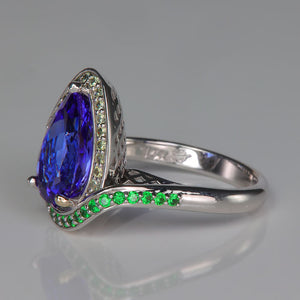 garnet accented tanzanite gemstone ring