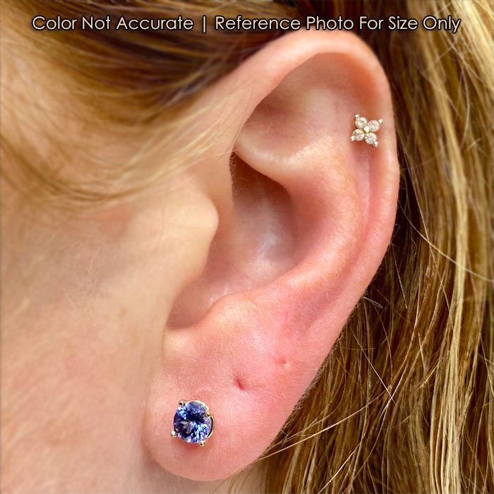 tanzanite stud earrings on ear 