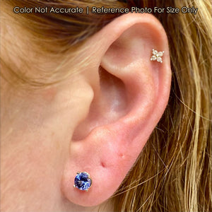 tanzanite stud earrings on ear 
