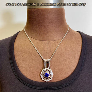 size of diamond and white gold tanzanite pendant on form