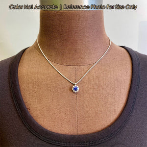 white gold tanzanite and diamond pendant
