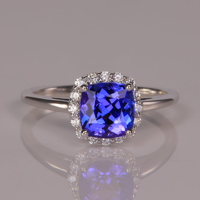 blue violet tanzanite and diamond halo ring