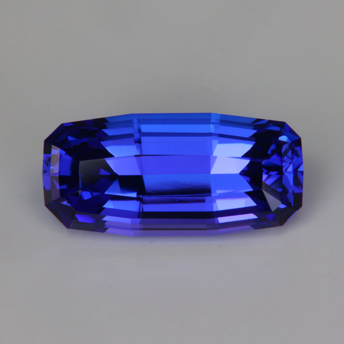 violet blue tapered emerald  cut tanzanite gemstone 