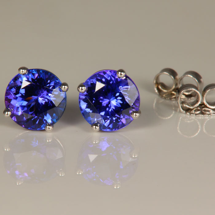 Four Prong 3 carat tanzanite earrings blue purple color