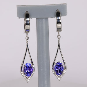 oval cut tanzanite and diamond earrings in white gold
