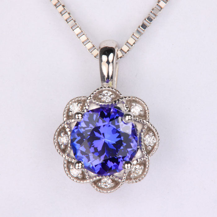 round cut tanzanite gemstone pendant in white gold with diamonds