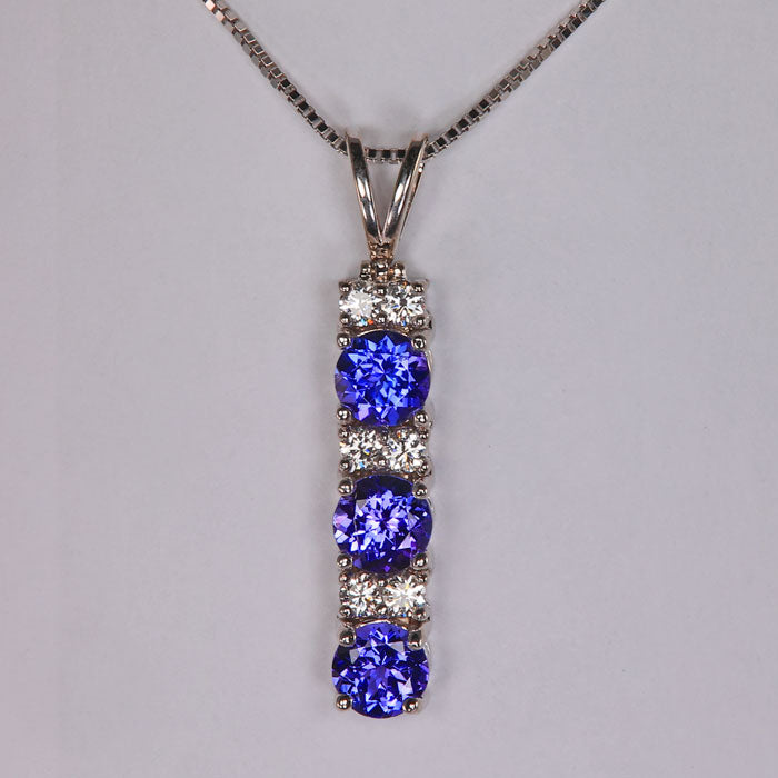 tanzanite and diamond pendant in white gold