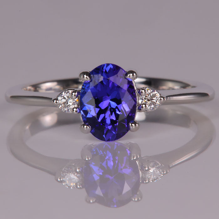 one carat oval tanzanite gemstone ring with diamonds