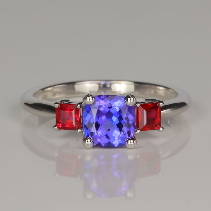 White gold tanzanite gemstone ring with ruby accents