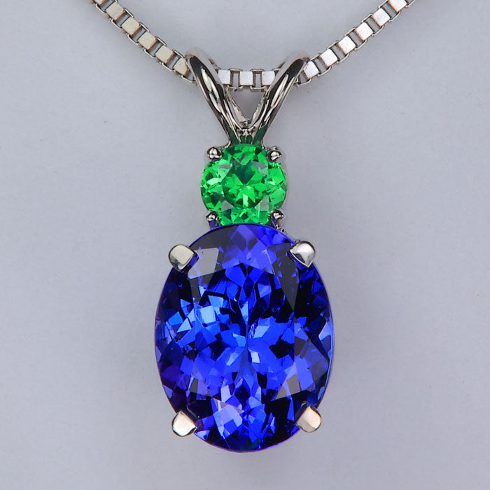 oval cut violet blue tanzanite and tsavorite garnet gemstone pendant in white gold