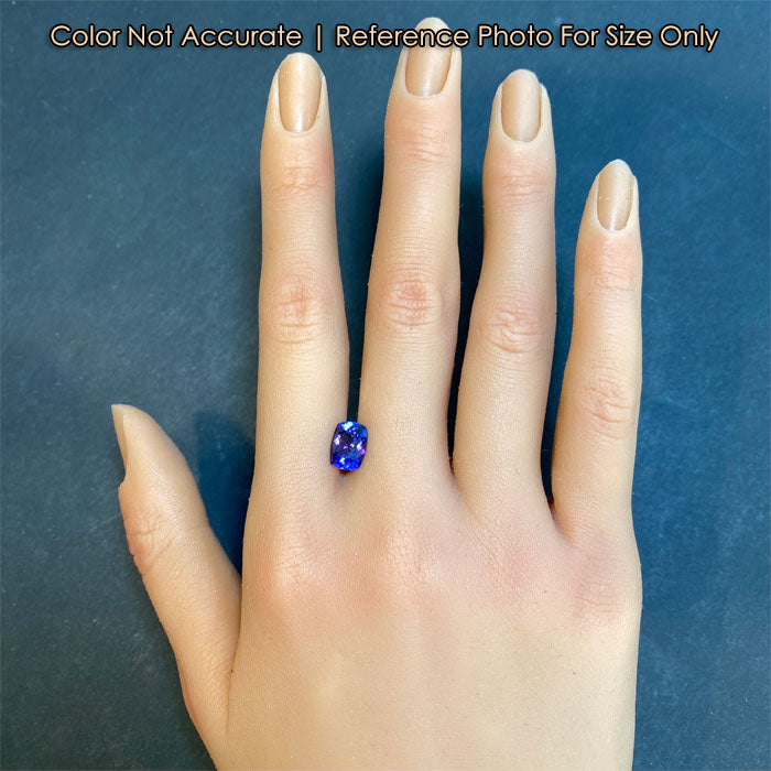 violet blue tanzanite gemstone on hand size