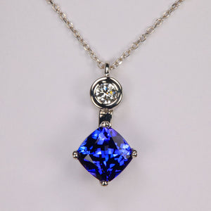 square cushion tanzanite pendant in white gold with diamond accent