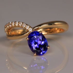 Oval Tanzanite ring in 14k yellow gold with fine diamond accents