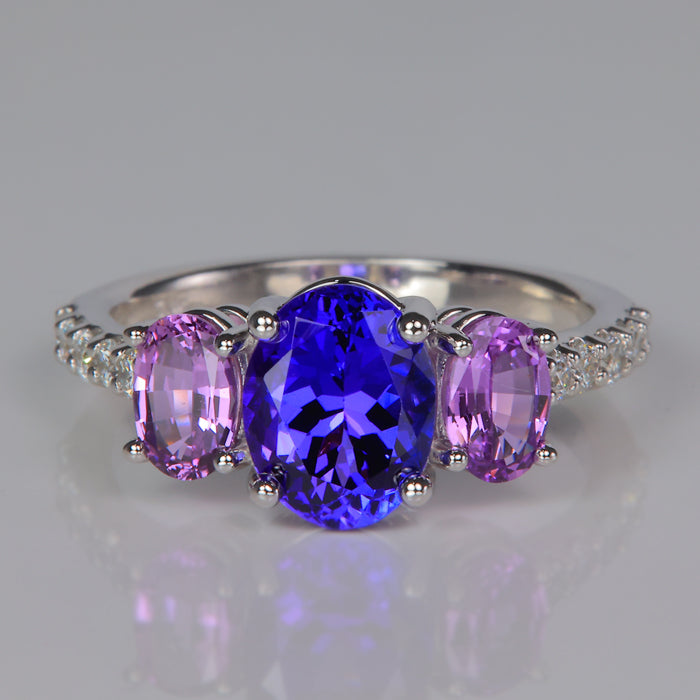 white gold oval cut tanzanite gemstone ring with purplish pink oval sapphires and diamonds