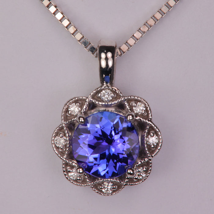 blue violet tanzanite gemstone pendant in white gold with diamonds