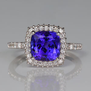 square cushion cut tanzanite and white gold and diamond halo ring