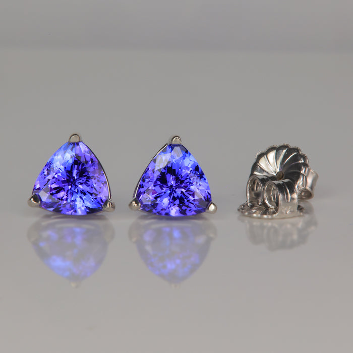 white gold stud earrings with trilliant cut tanzanite gemstone