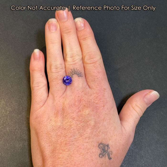 round brilliant tanzanite gemstone size to a hand