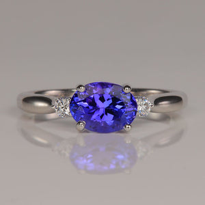 oval tanzanite and white gold ring with diamond accents 