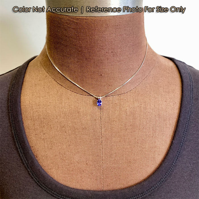 size reference of tanzanite and white gold pendant on form