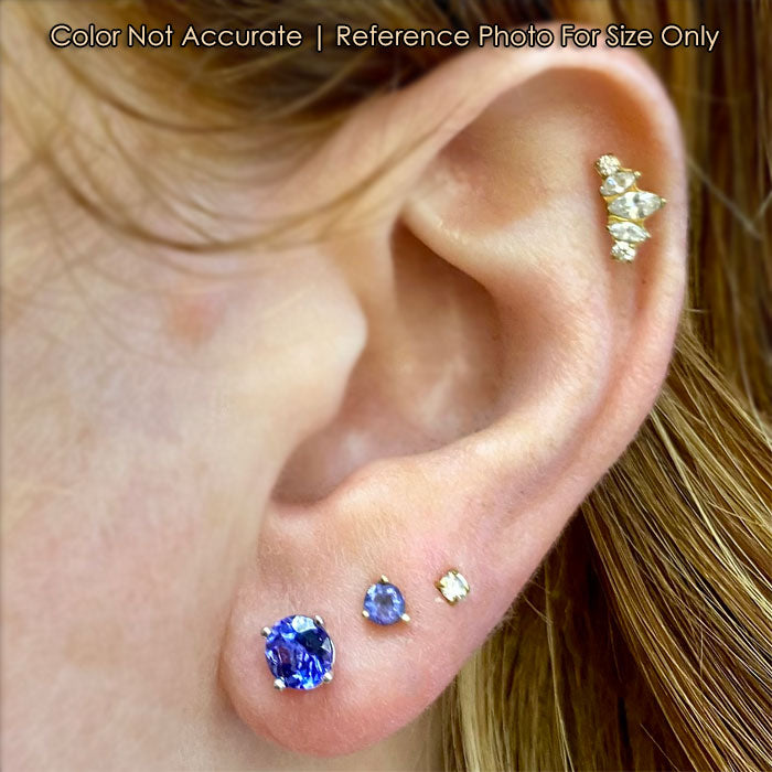 tanzanite stud earrings in white gold on ear
