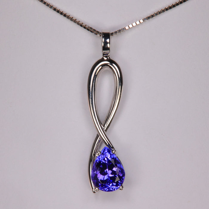 A white gold amethyst and tanzanite pendant