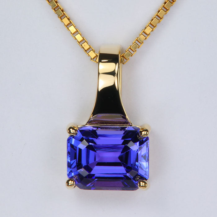 emerald cut tanzanite gemstone pendant in yellow gold