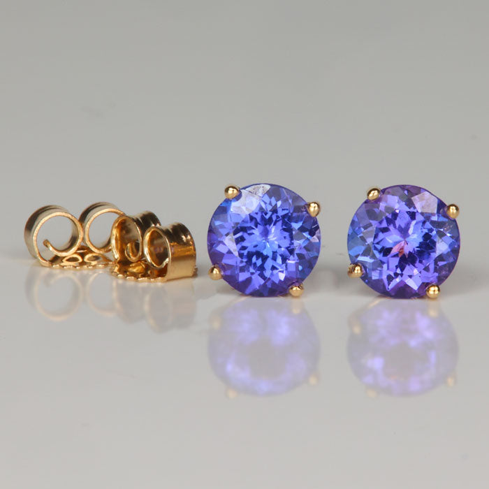 round brilliant tanzanite earrings in yellow gold