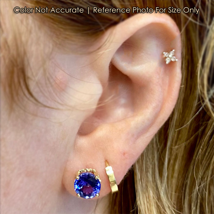 tanzanite gemstone earrings in yellow gold 