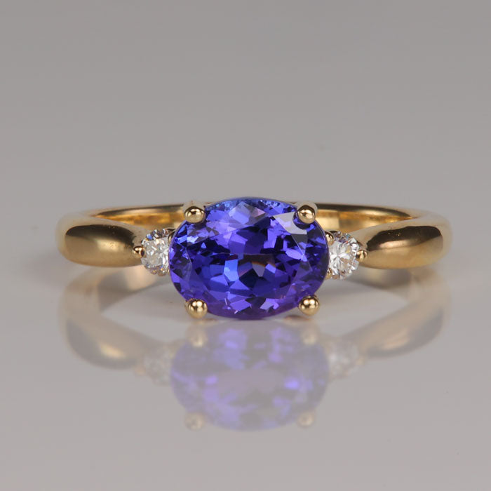 oval blue violet tanzanite gemstone ring in yellow gold