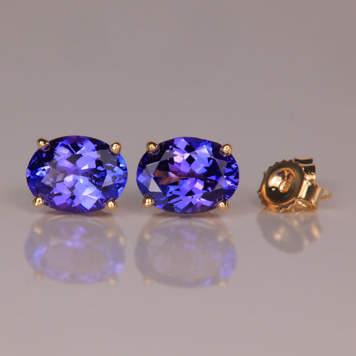 oval cut tanzanite gemstone earrings in yellow gold