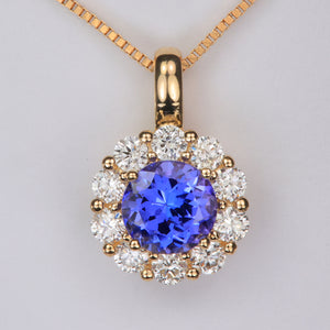 round brilliant cut tanzanite in yellow gold pendant with diamond halo