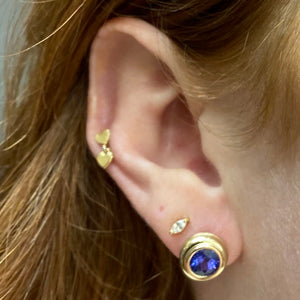 round cut tanzanite bezel set yellow gold earrings