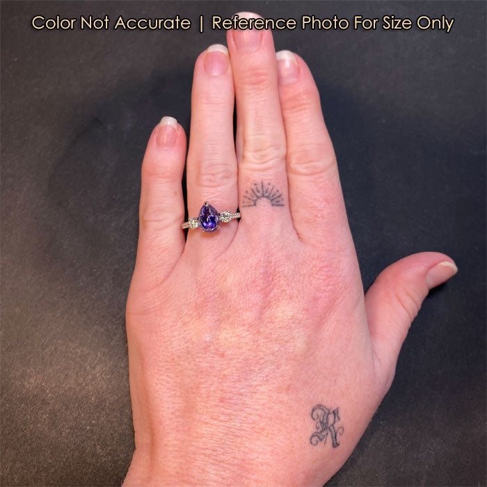 platinum diamond and tanzanite ring size to a hand