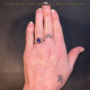 platinum diamond and tanzanite ring size to a hand