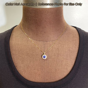 size of gold tanzanite and diamond halo pendant