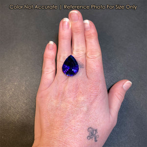 size of pear shape tanzanite gemstone to hand