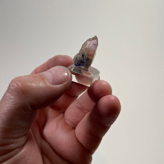 natural pink tanzanite in hand