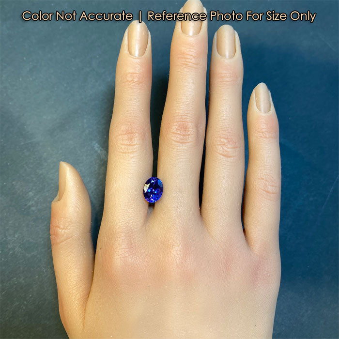 violet blue tanzanite gemstone size to hand